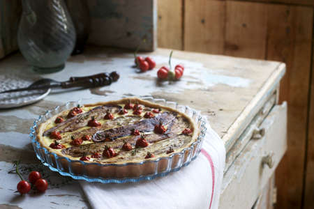 Pie stuffed with vegetables, cottage cheese and cream on a wooden background. Rustic style.の写真素材