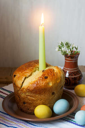 Traditional easter cake and colored eggs - easter still life. Rustic style.