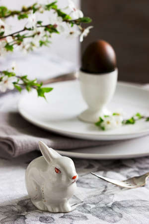 Decorated Easter table with blooming cherry plum. Selective focus.の写真素材
