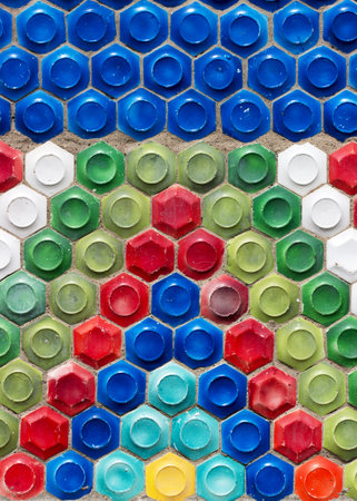Mosaic of the Soviet period in the form of honeycombs on a concrete wall.