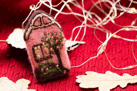 Handmade wool brooch on a sweater background. Selective focus.の写真素材