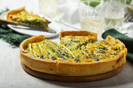 Tart stuffed with asparagus, spinach, chard, cream and cheese, served with white wine. Rustic style,...