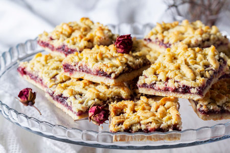 Streusel pie with currant and rose petal filling on a light background.の写真素材