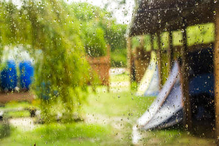 raindrops on the window glass of campingの写真素材