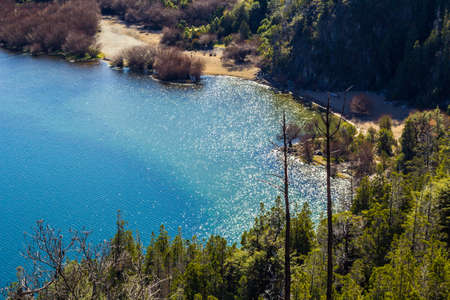 Panoramic view of the beautiful park and lake in Lago Puelo - Argentina in the autumnの写真素材