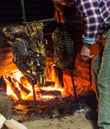 Roasted Cow and lamb on the fireの写真素材