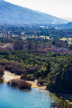 Panoramic view of the beautiful park and lake in Lago Puelo - Argentina in the autumnの写真素材