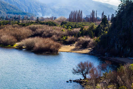 Panoramic view of the beautiful park and lake in Lago Puelo - Argentina in the autumnの写真素材