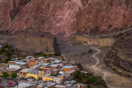 View of Iruya village and multicolored mountains in the surroundings at sunset, Salta province, Argentina, iruya - San Isidro - San Juan treekingの写真素材