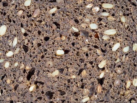 Macro view of piece of dark bread.