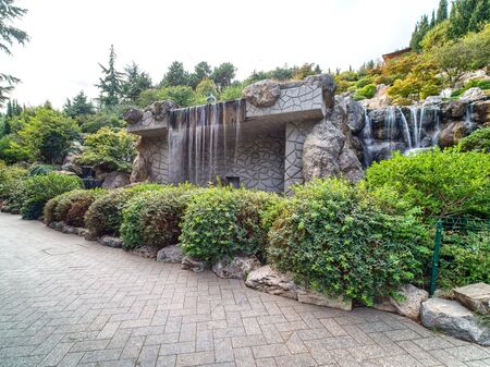 PARTENIT, CRIMEA, RUSSIA - SEPTEMBER 16, 2019: Beautiful artificial waterfall in the park.のeditorial素材