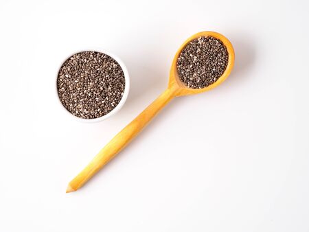 Chia seeds isolated on white background in different dishes. Copyspace for text.の写真素材