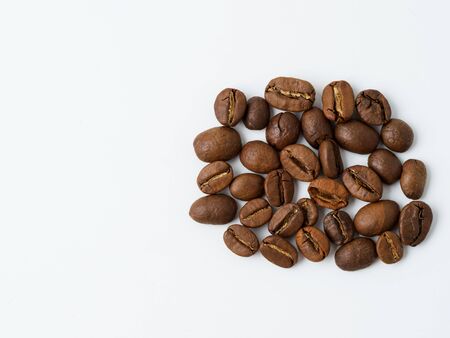 Roasted coffee beans isolated on white background. Copyspace for text.の写真素材