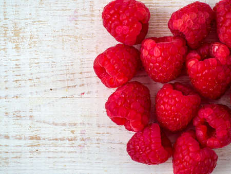 Fresh raspberry on wooden background.の写真素材