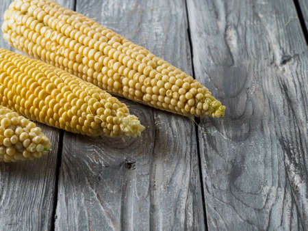Ear corn on wooden background.の写真素材