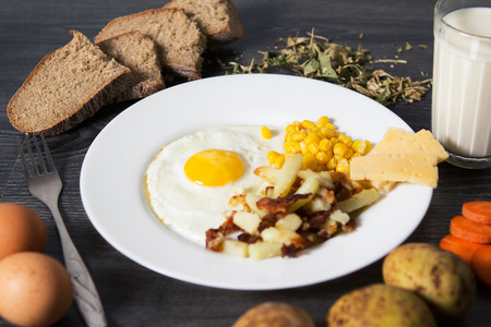 Fried eggs with garnishの写真素材