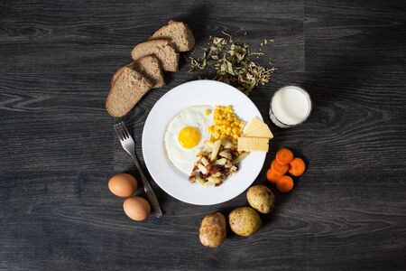 Fried eggs with garnishの写真素材