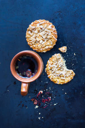 Herbal tea with biscuits on a textured black backgroundの写真素材