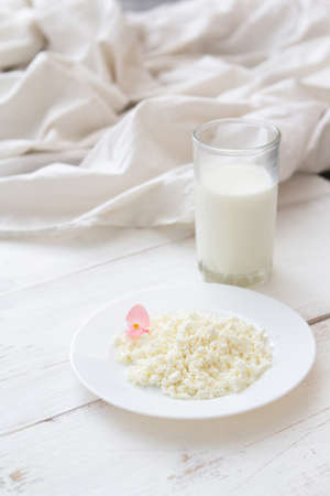 Morning - cottage cheese with milk for breakfastの写真素材