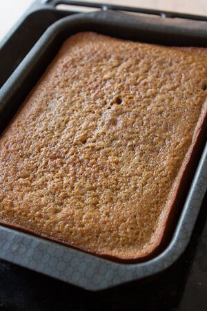 home made cake in a baking sheetの写真素材