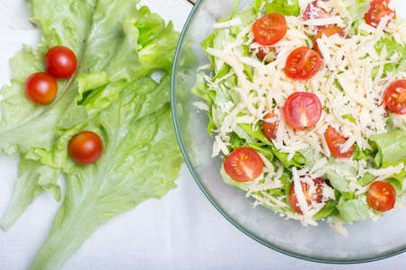 Caesar salad vegetarian on a wooden white backgroundの写真素材