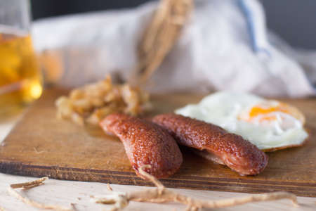 fried eggs with sausages and fried cabbage, rusticの写真素材