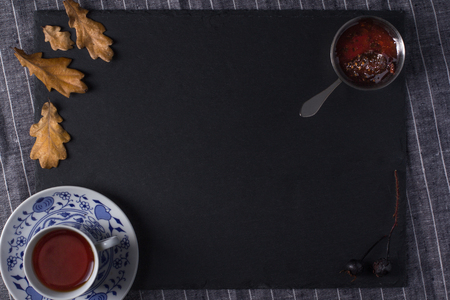 Cup for tea, located on a black board, top viewの写真素材