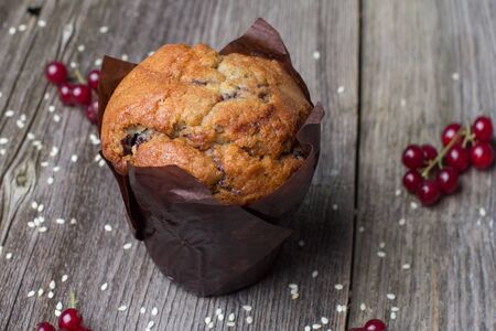Fresh muffin with berries on the rustic table for breakfastの写真素材