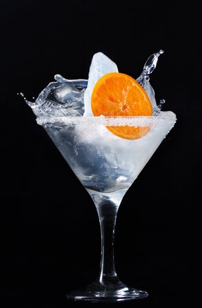 Unusual cocktail with ice in a martini glassの写真素材