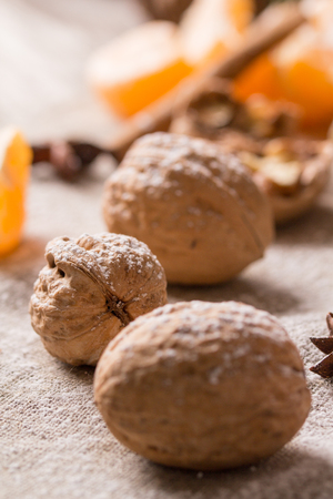 Christmas still life - tangerine and walnuts with spicesの写真素材