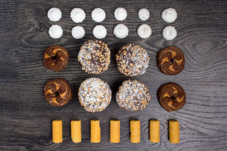 still life - set of sweets on a black background