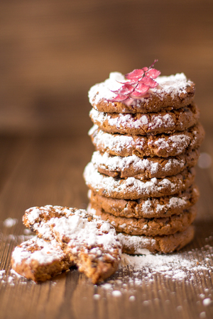 Stack of sugar cookies on a wooden backgroundの写真素材