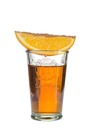 Shot. Alcoholic drink with orange slice on a white background. isolated.の写真素材