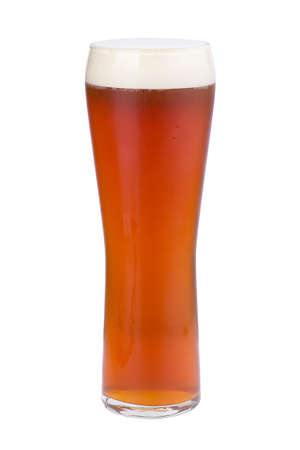 A glass of refreshing light beer. Golden beer with foam. Isolated.の写真素材