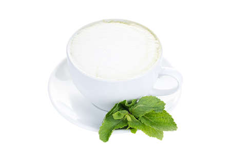 A cup of hot coffee with milk and mint for decoration, isolated on white background. Coffee with foam in a cup. isolated.の写真素材