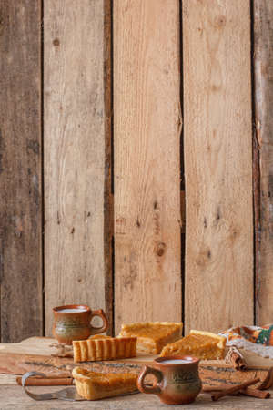 Fresh Homemade Pumpkin Pie made for Thanksgiving. Pie on a wooden background. Rustic.の写真素材