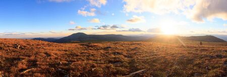 Sunset in the mountains. The nature of the Southern Urals. Sunset sky over the forest and mountains. Panoramic view. Travel.の写真素材