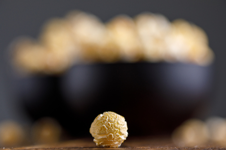 Popcorn macro. A bowl of popcorn in the background. Close-upの写真素材