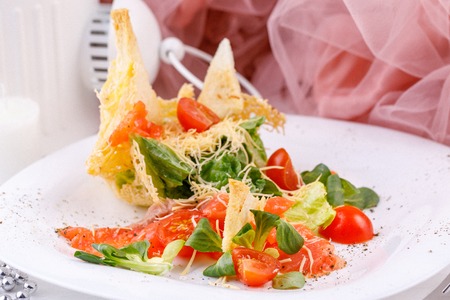 Original supply of carpaccio with fresh tomatoes. Close-up.の写真素材