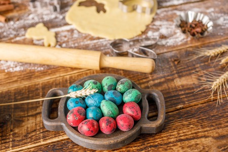 Original still life with Easter eggs and quail eggs for baking curly cookies.の写真素材