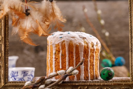 Fresh, beautiful, home, Easter cake close-up. Willow twigs and Easter cake for the holiday.
