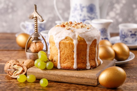 A table prepared for Easter. Easter tea drinking. Delicious home Russian cake with raisins and nuts...