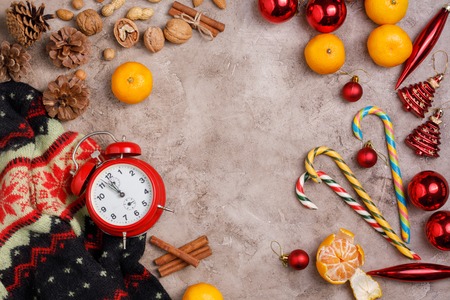 Christmas background. New Year's holiday with tangerines and sweets. View from above. Free space for...