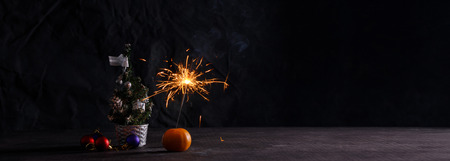 Holiday symbols on a dark background. Christmas banner. Atmosphere of the New Year. Card with...