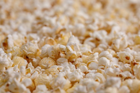 Salted popcorn close up. Popcorn background. Snacks and food to watch the movie.の写真素材