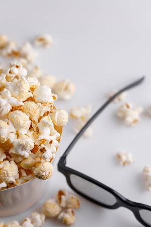 Snack to watch movies. Popcorn and glasses for viewing 3D. Close-up.