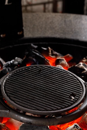 Hot empty charcoal BBQ grill with bright flames on Cookout. Concept. Close up.の写真素材