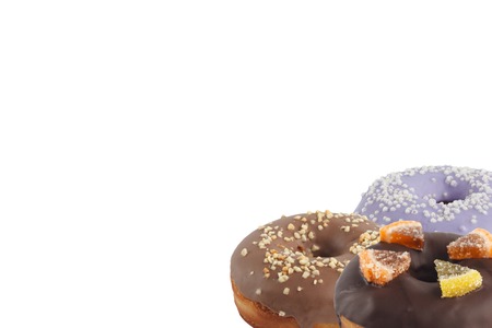 Different bright tasty donuts on a white background. Place under the text. Diversity. Close-up.の写真素材