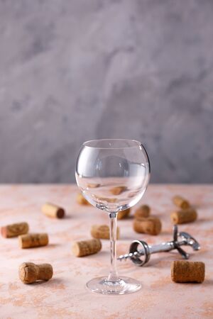 Empty wine glass. Nutrmor with a glass and wine corks. The concept of winemaking. Place under your text. Close-up.の写真素材