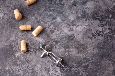 Exquisite vintage corkscrew for wine on a textural background. Copy space. Place for your text. Close-up.の写真素材